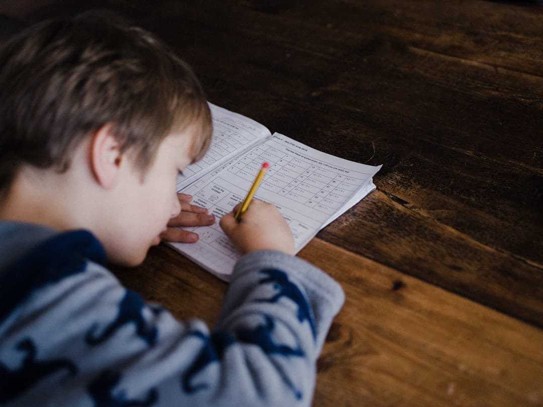 Educational photo of student studying and note taking